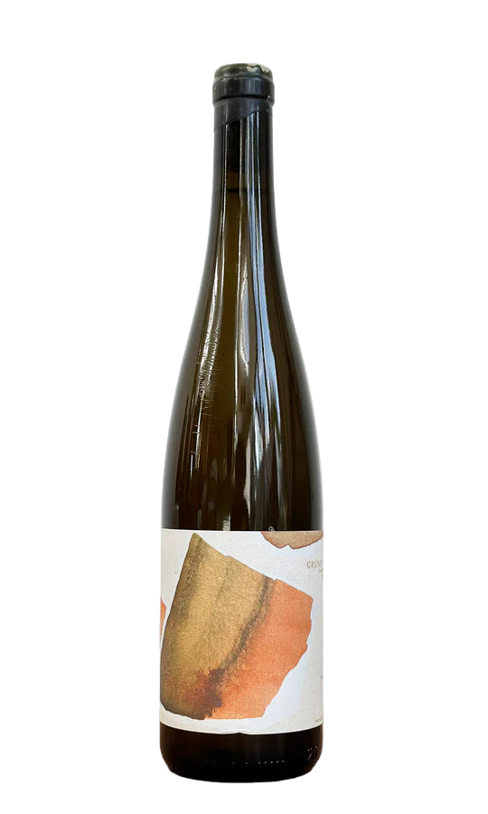 Wine bottle with a label on a wooden surface and white background
