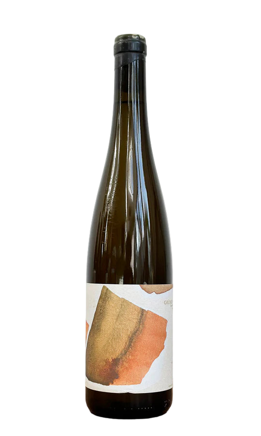 Wine bottle with a label on a wooden surface and white background